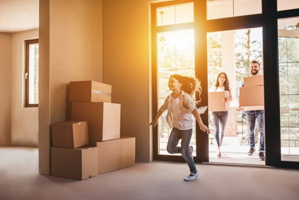 Family entering new apartment