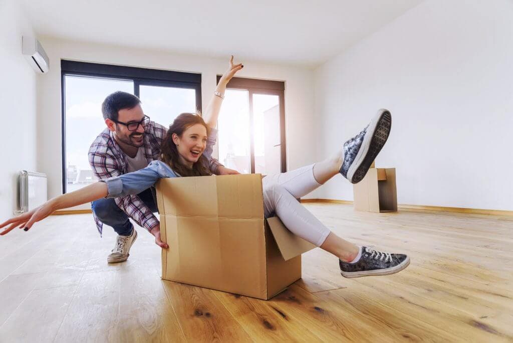 Happy couple in a new apartment