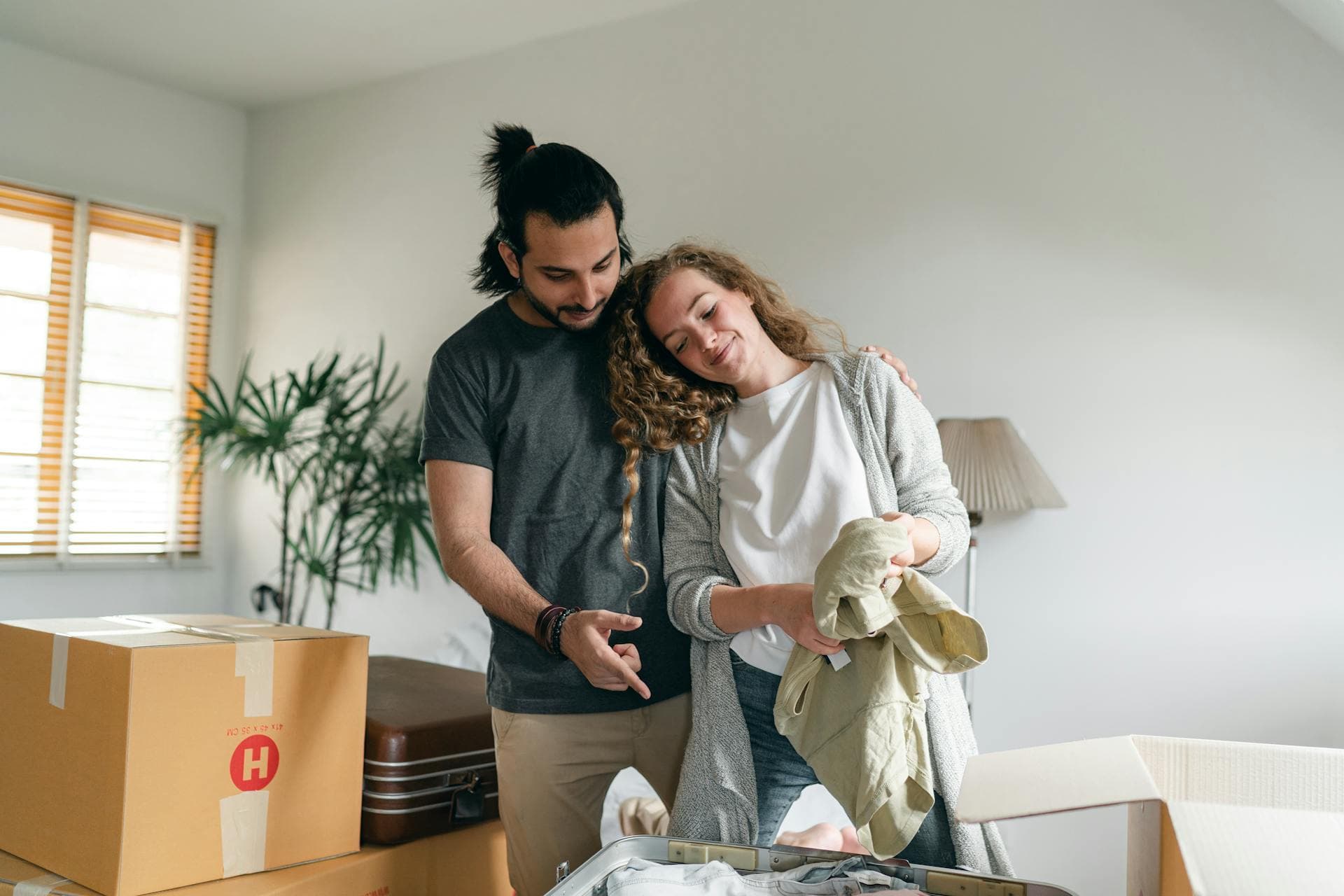 Happy couple unpacking
