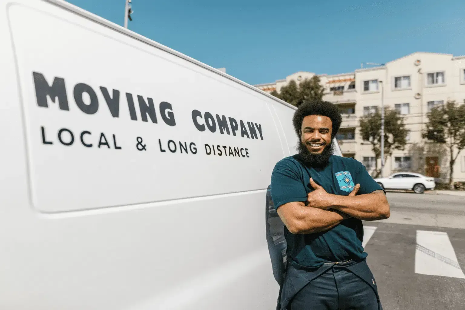 Mover standing next to truck