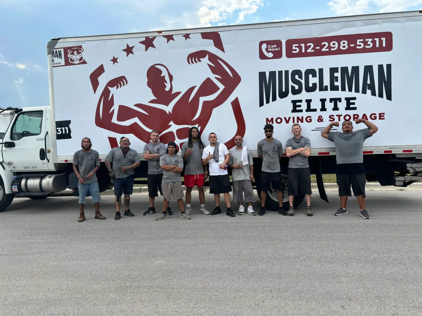 Muscleman Elite crew with the branded box truck on a North Austin job