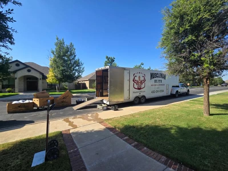 Muscleman Elite branded moving truck and trailer on a residential move in Midland, Texas (Permian Basin)