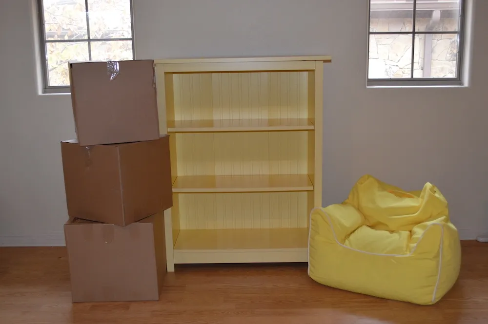 Yellow furniture and moving boxes