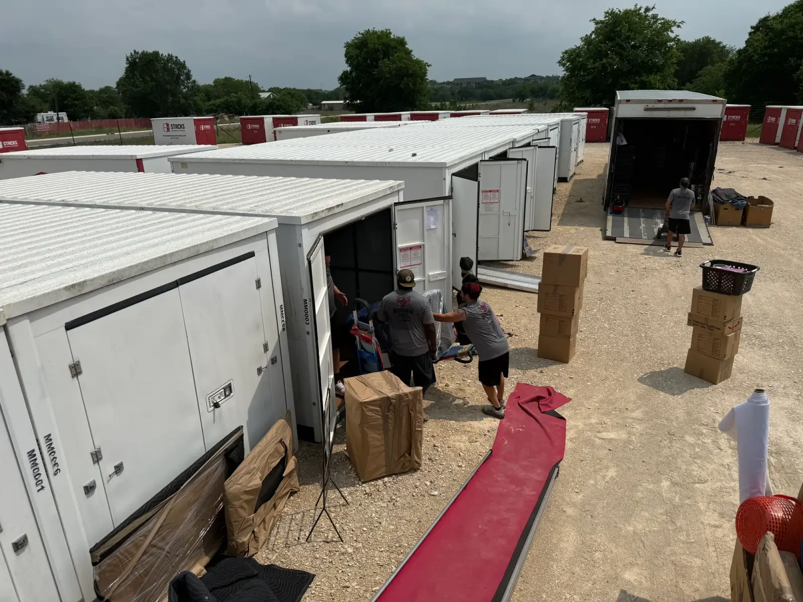 Muscleman Elite crew loading a row of climate-controlled storage units