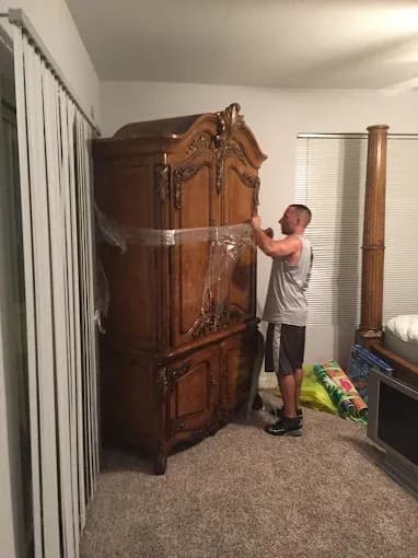 Muscleman Elite mover wrapping furniture with premium materials