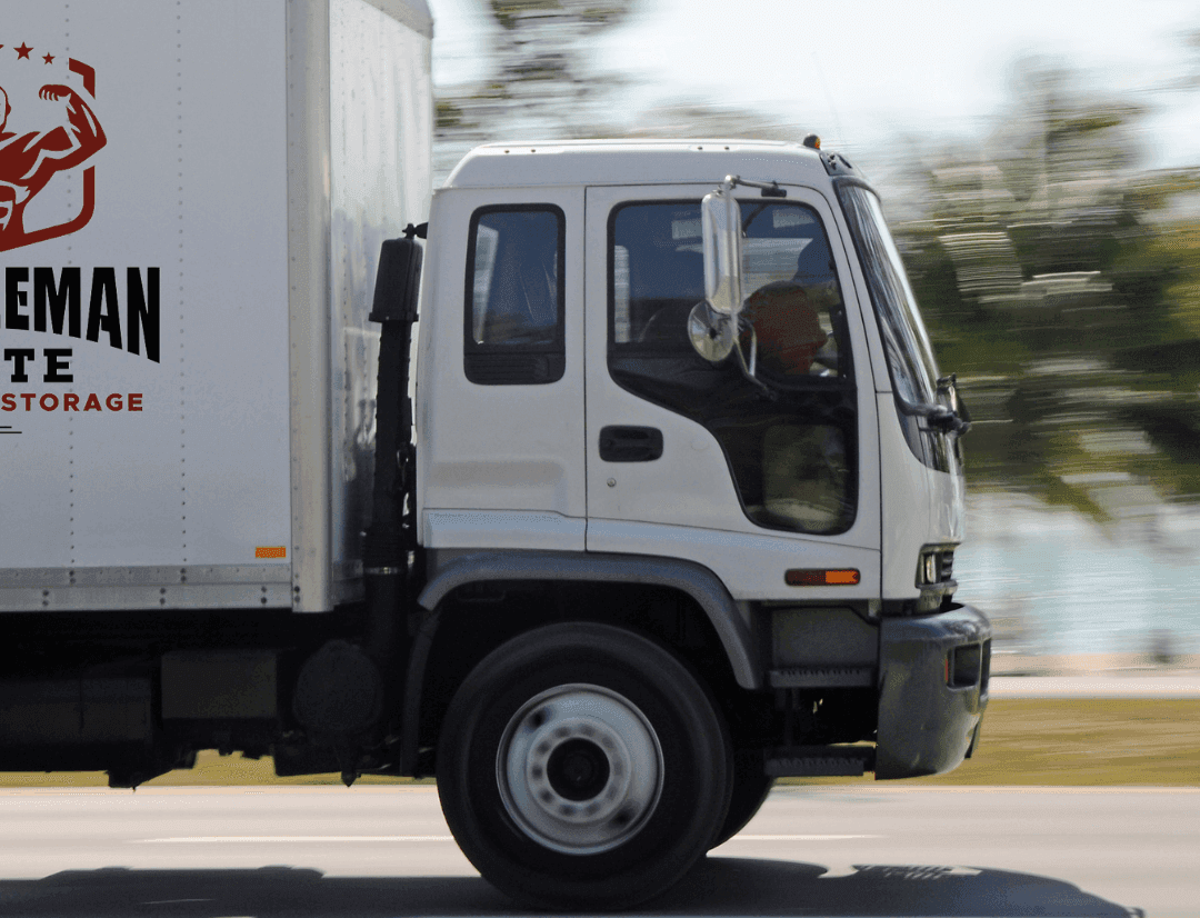 MuscleMan Elite Moving & Storage truck on the road