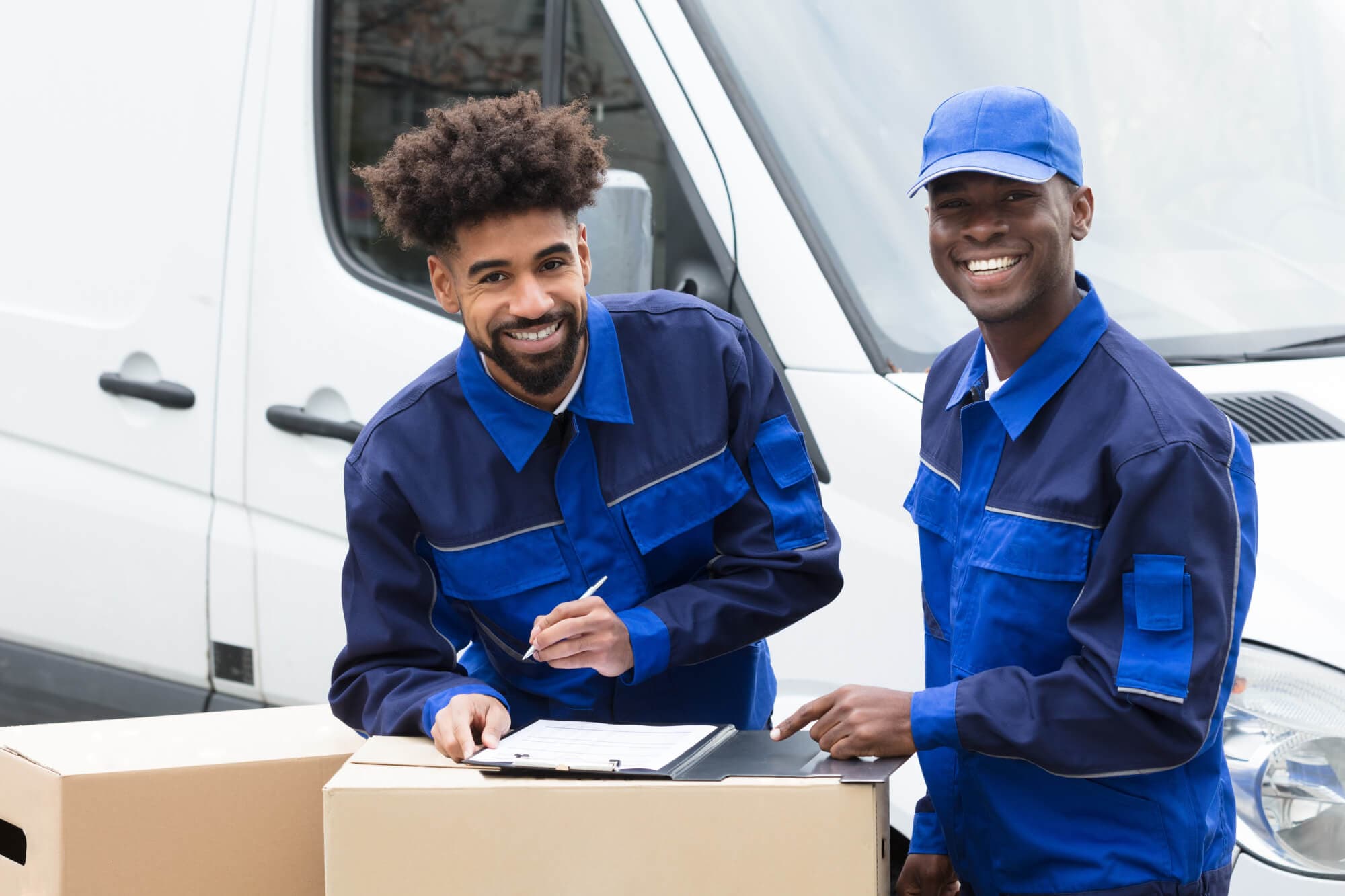 Two smiling movers singing documents