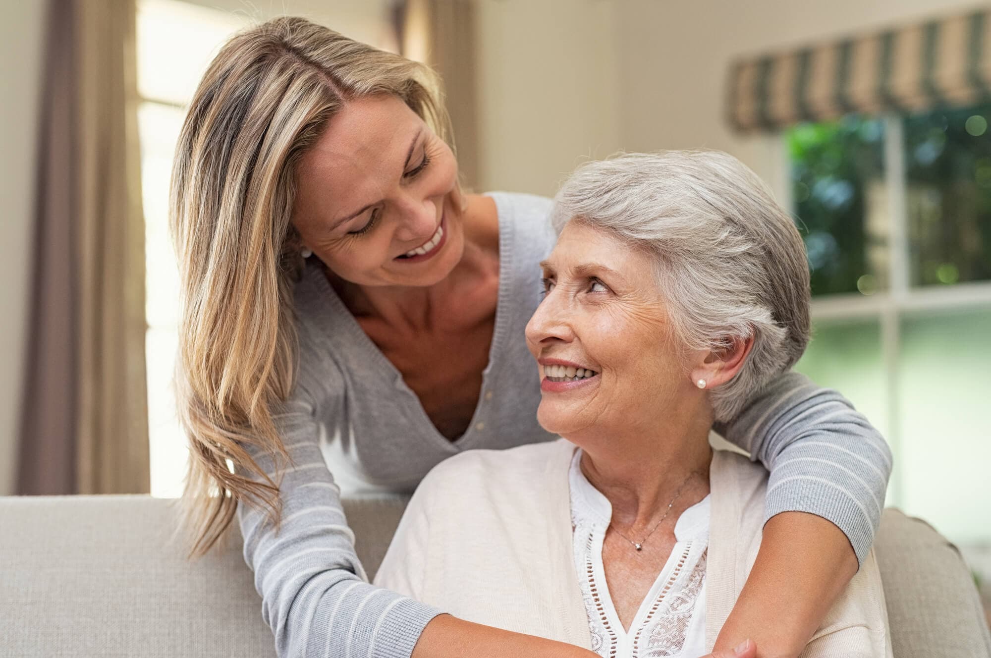 Woman with hear elderly parent