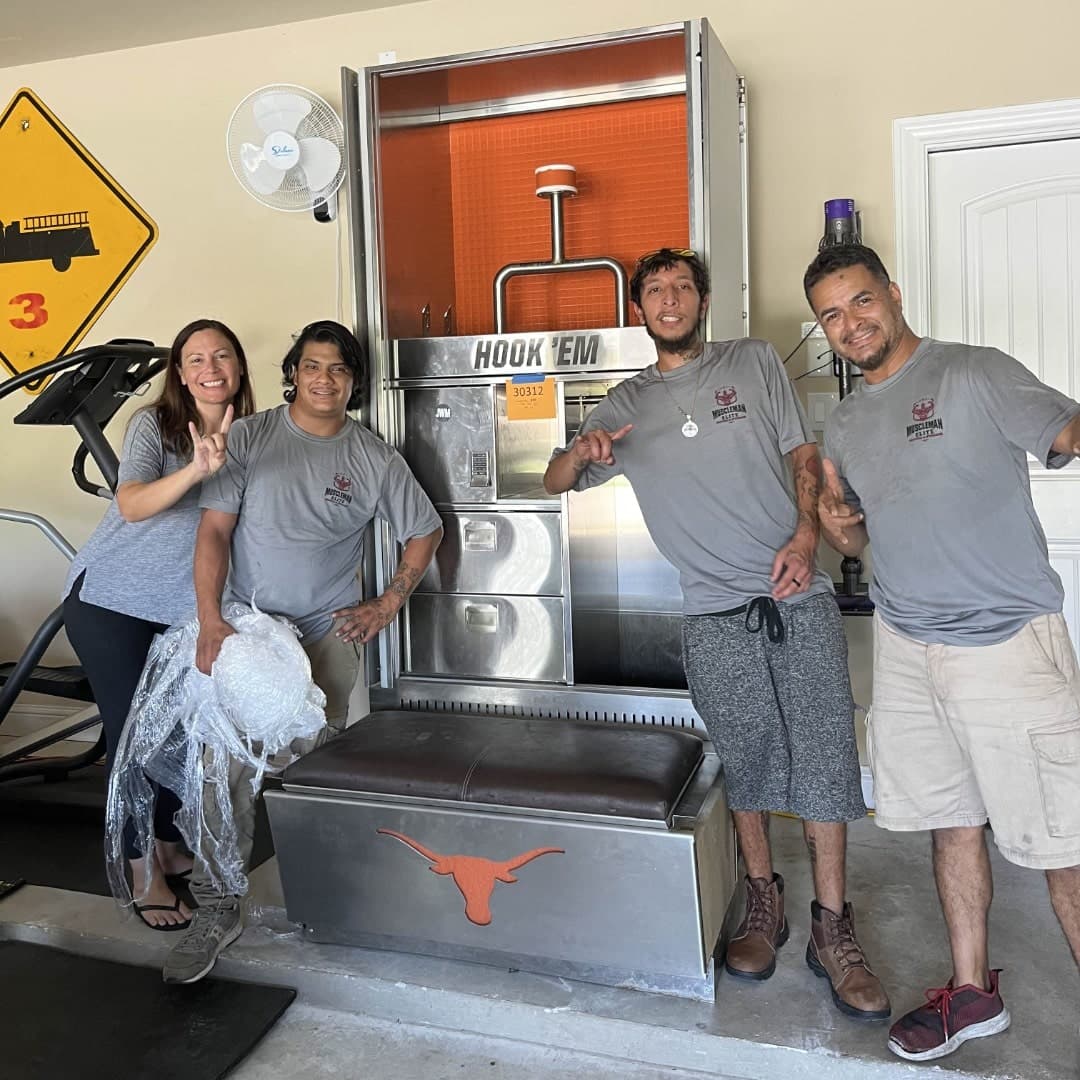 Muscleman Moving crew member carrying wrapped items down stairs
