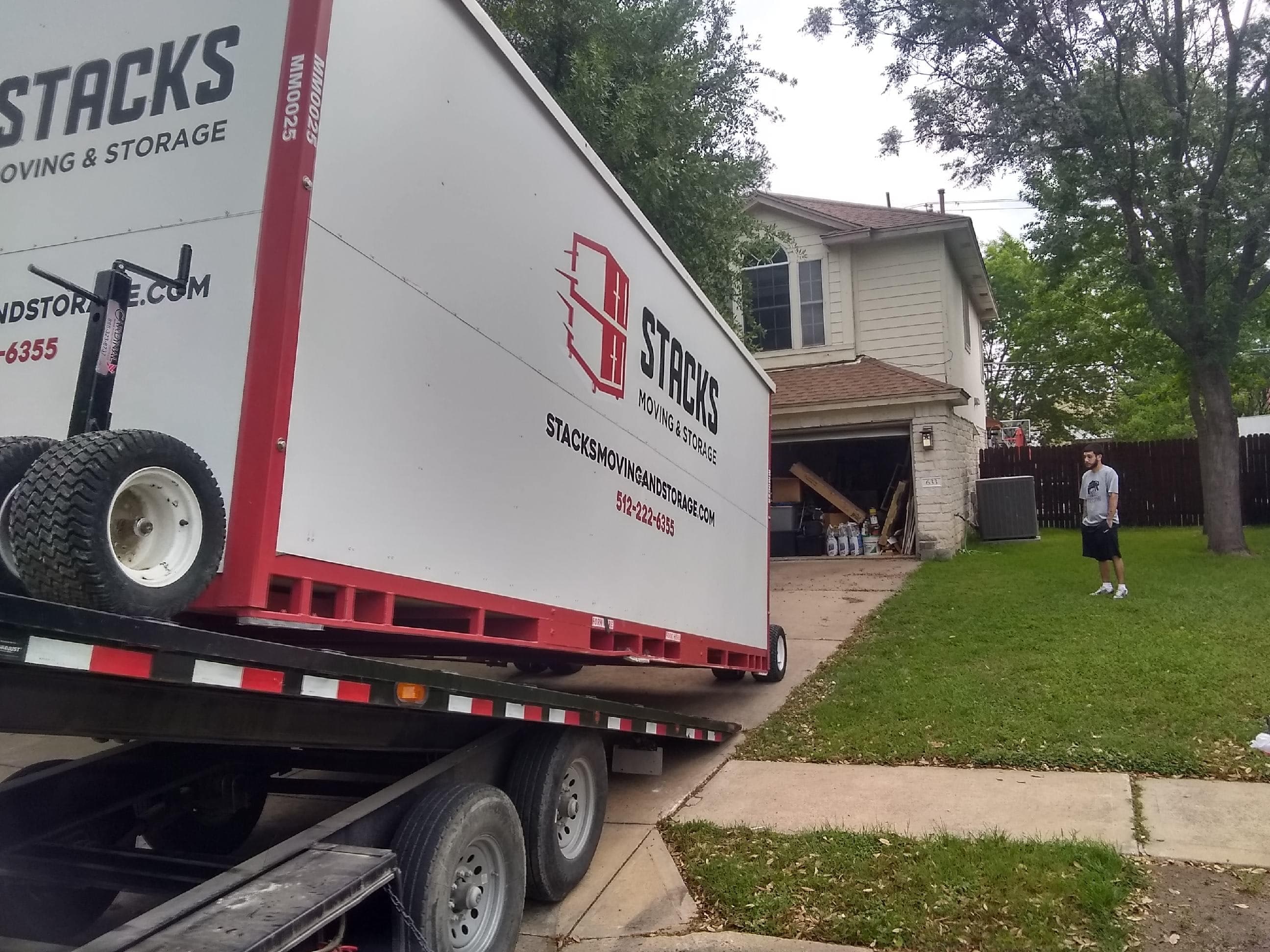 Storage facility loading dock with moving equipment