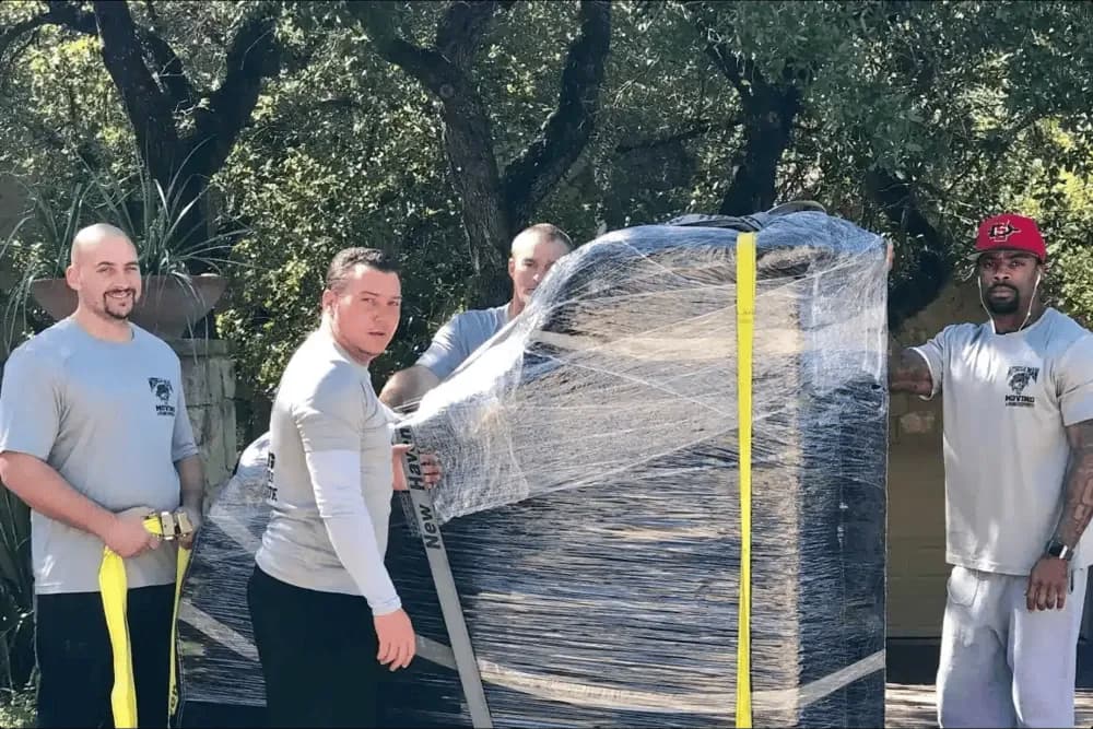 Muscleman Elite Moving team in branded uniforms