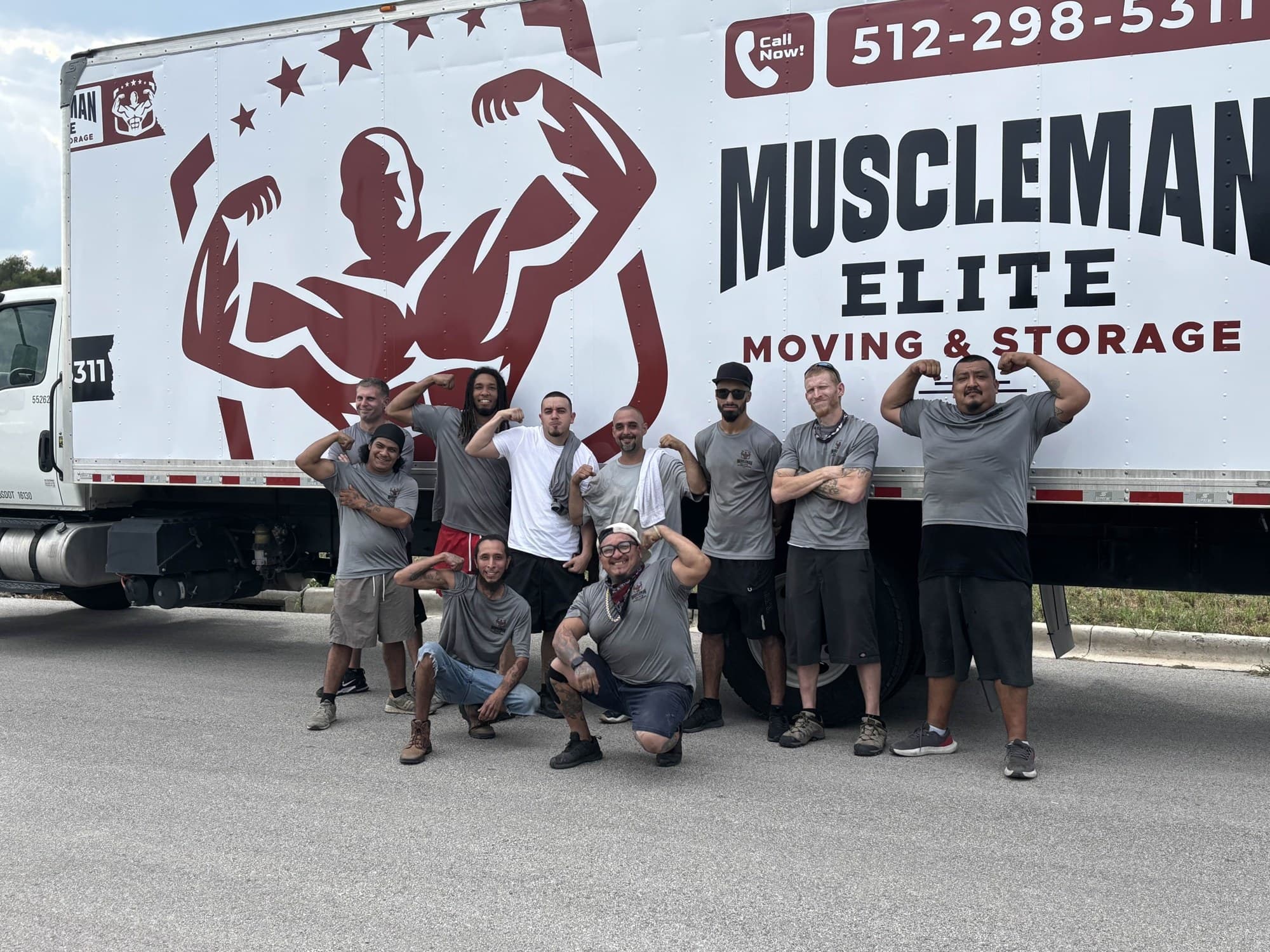 Muscleman Elite crew with branded moving trucks in Austin
