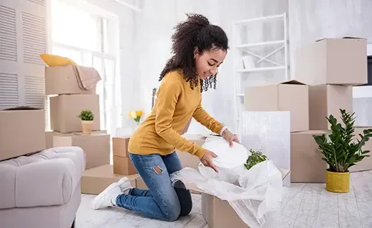 Girl in yellow unpacking stuff