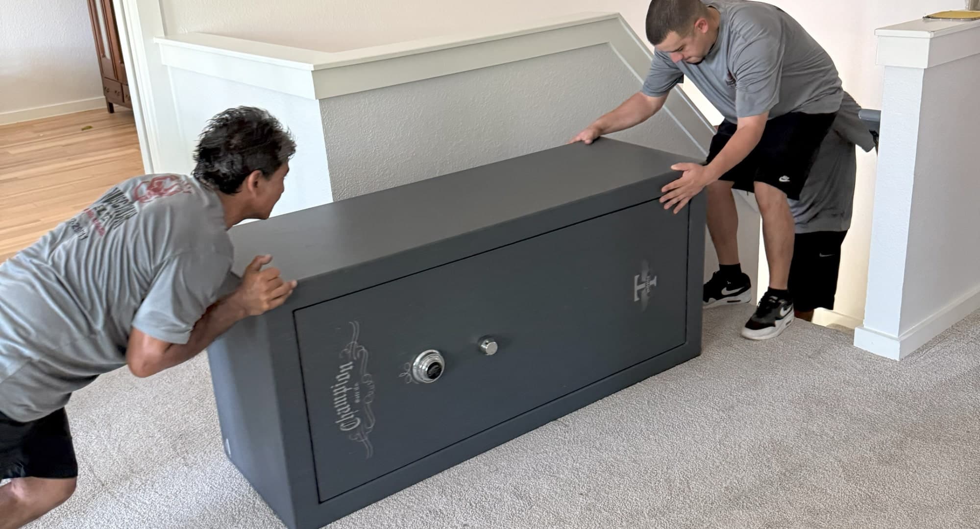 Large gun safe being transported through a doorway
