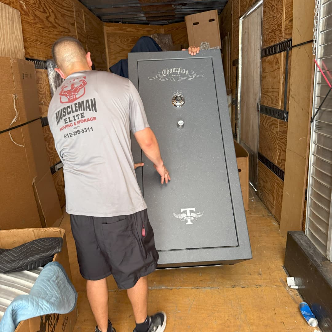 Heavy gun safe being moved by specialty movers