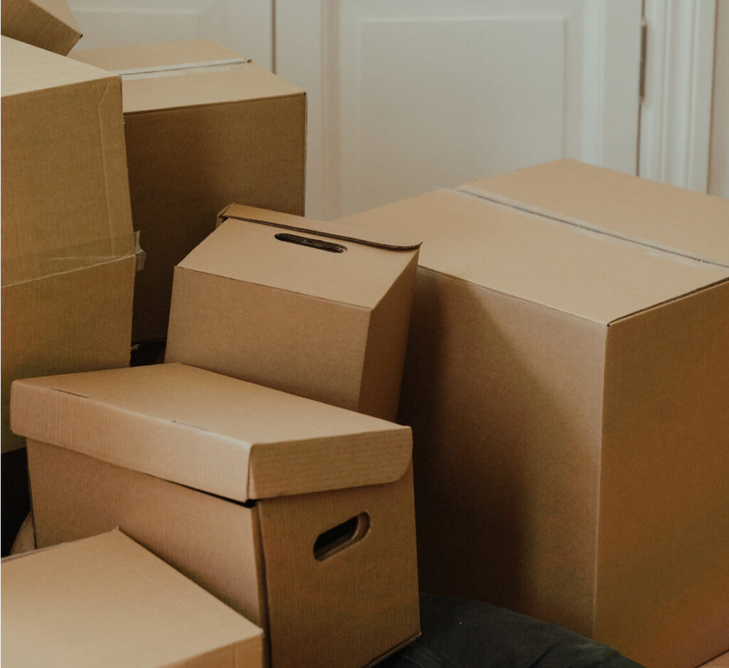 Moving boxes stacked in a room.