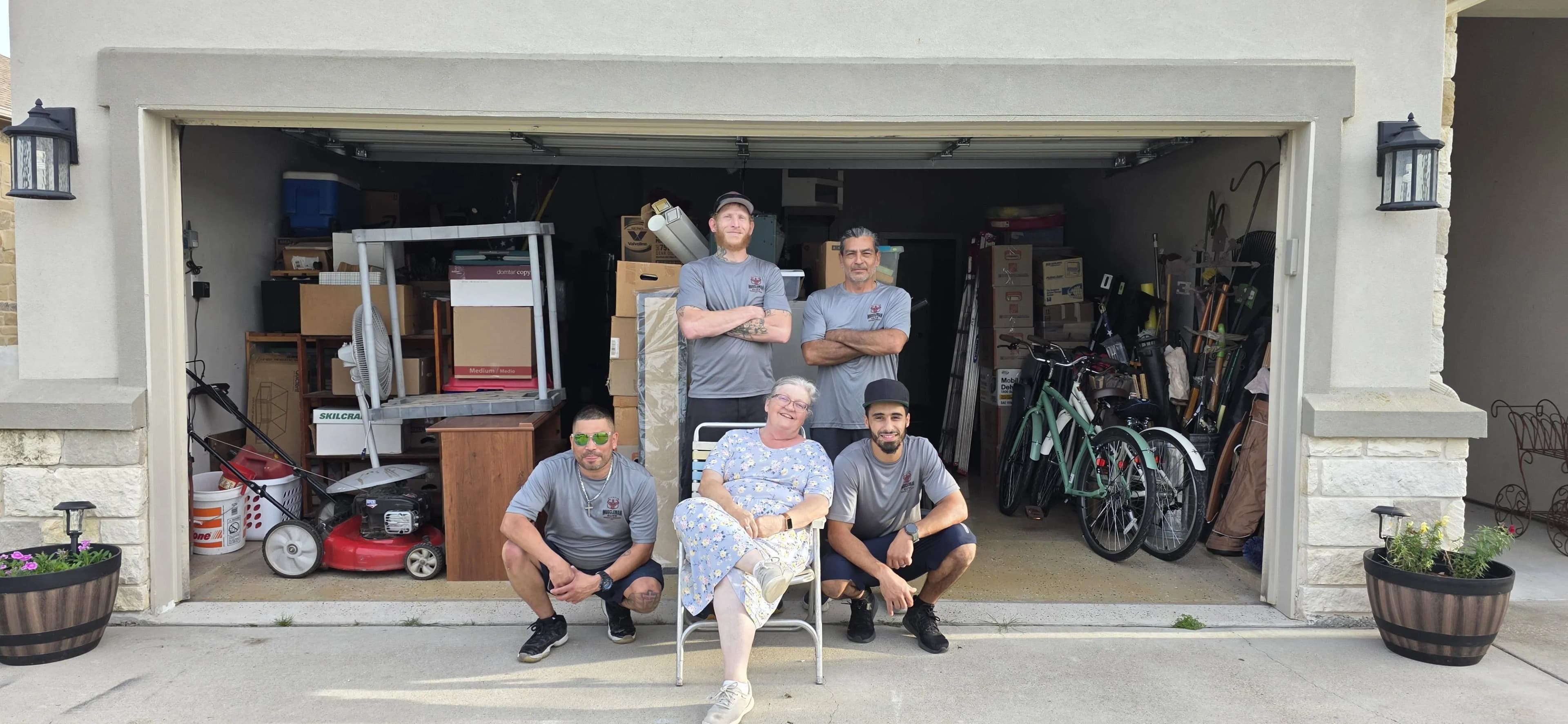Muscleman Moving crew with satisfied customer after completed Austin move